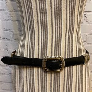 double-sided leather belt, black/brown, with metal buckle.